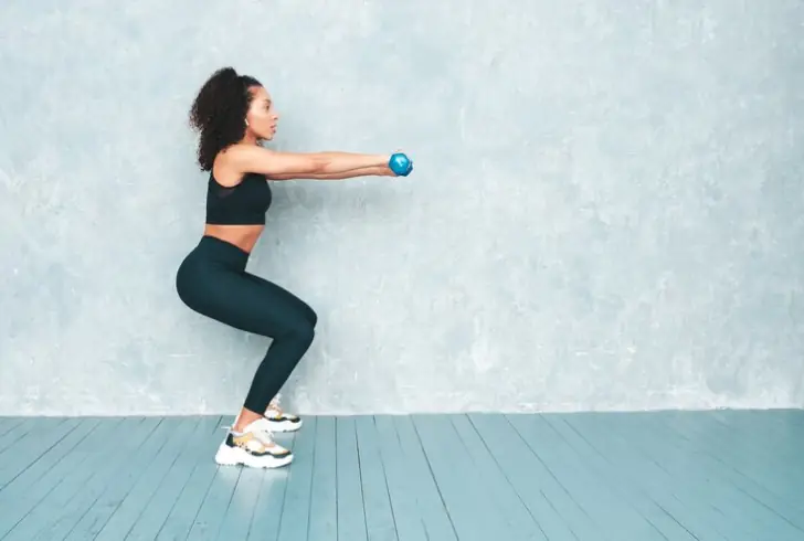 Image by halayalex on Freepik | Perform this exercise, grasp a pair of dumbbells, holding them next to your shoulders.