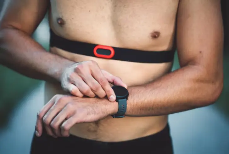 Man using multiple wearable health devices